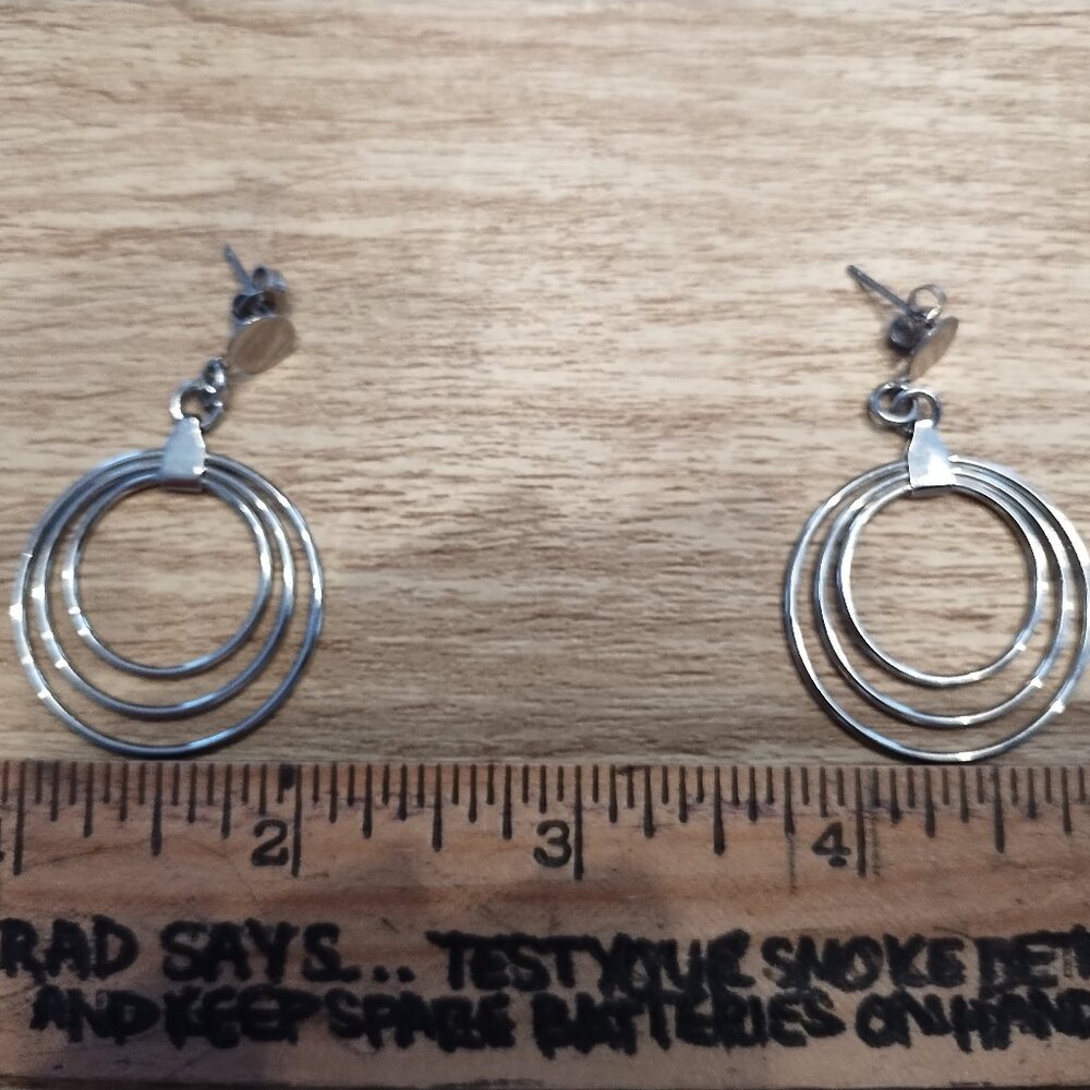 Costume jewelry silver hanging hoop earrings